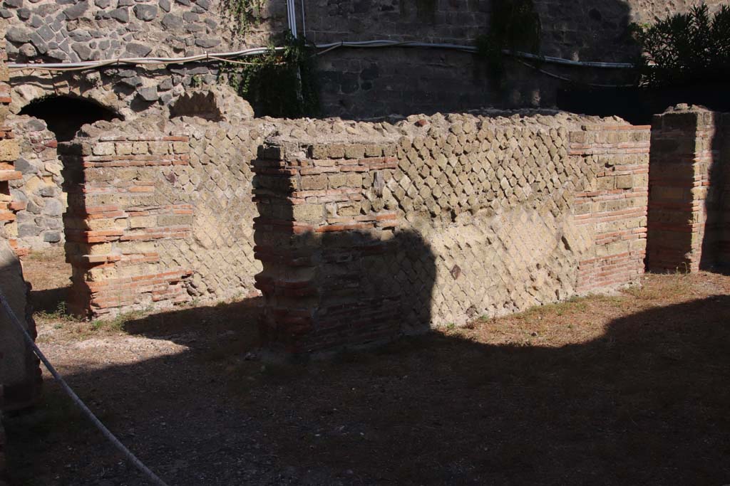 II.2 Herculaneum, September 2019. Looking towards west wall of exedra, at the north end (on right) was a doorway into a corridor/room.
Photo courtesy of Klaus Heese.
